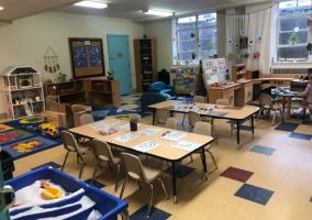  Preschool classroom. Two desks with several exploration and play areas.