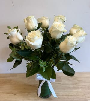 12 white roses in a vase