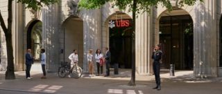 UBS main headquarter with a couple of people, who are walking and talking
